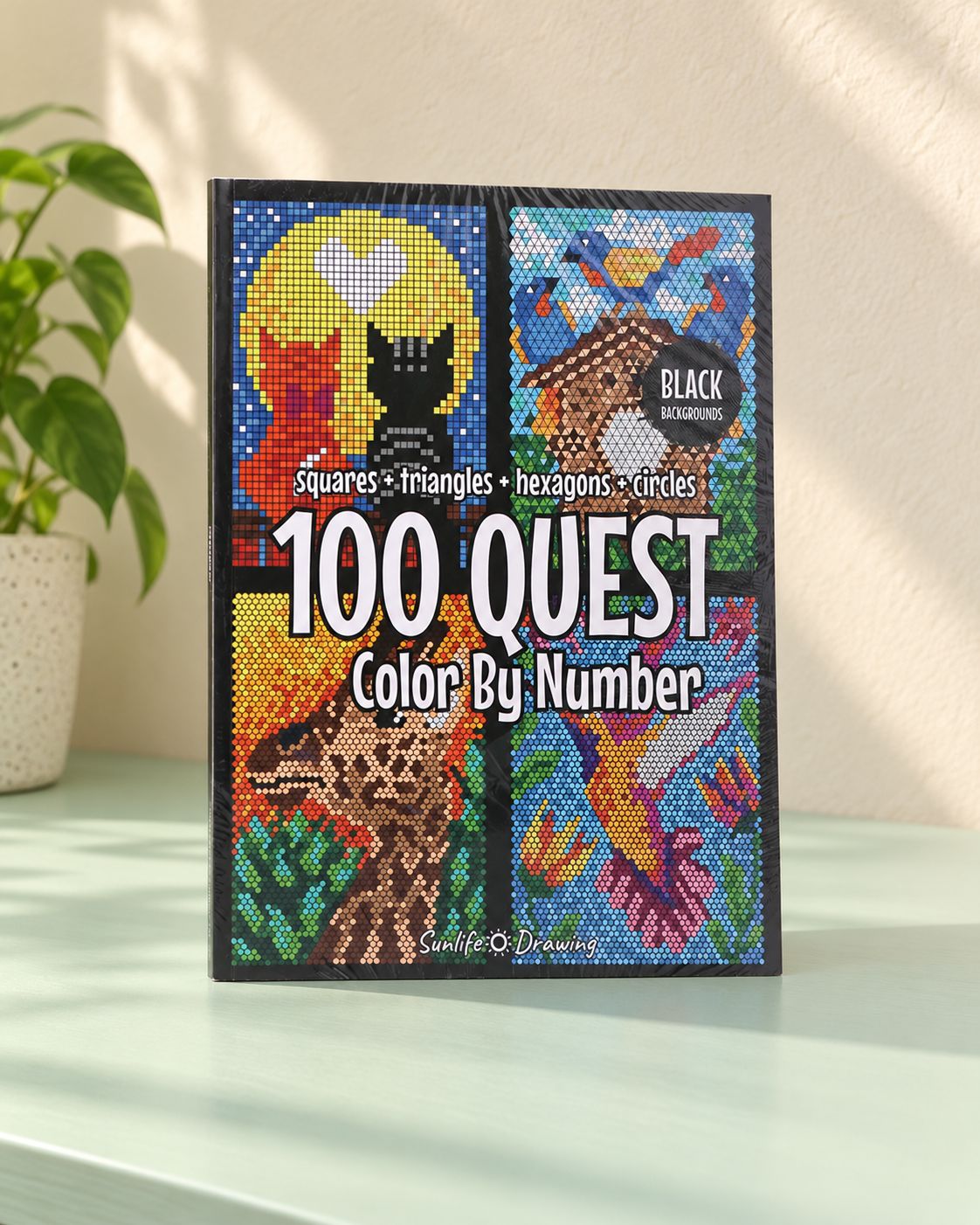 Cover of the geometric color-by-number book, with mosaic-style animals, standing on a table