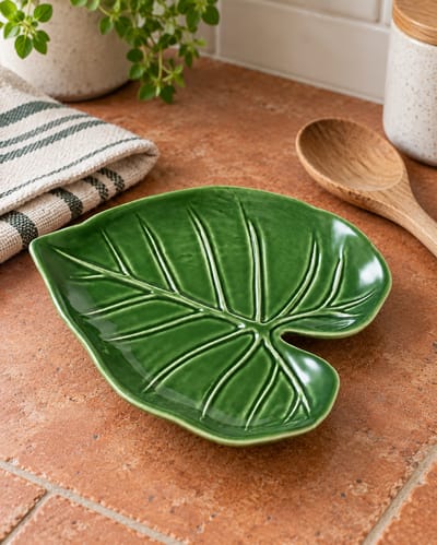 Green Leaf Spoon Rest on a cool gray stone surface