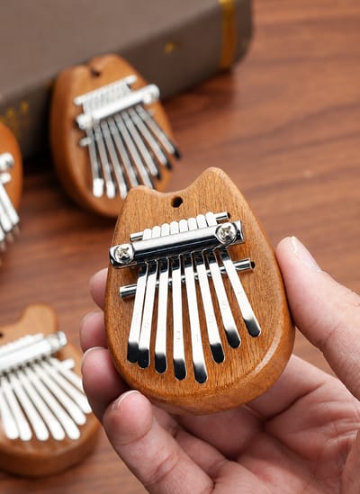 Mini Kalimba: Mini kalimba held in the hand
