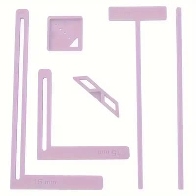 Purple Bookbinding Guides: The purple guides laid out individually