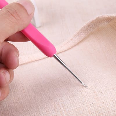 Color-Handled Crochet Hook Set: Hook held in the hand