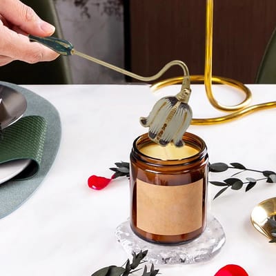 Floral Candle Snuffer: Snuffer lowered over a jar candle