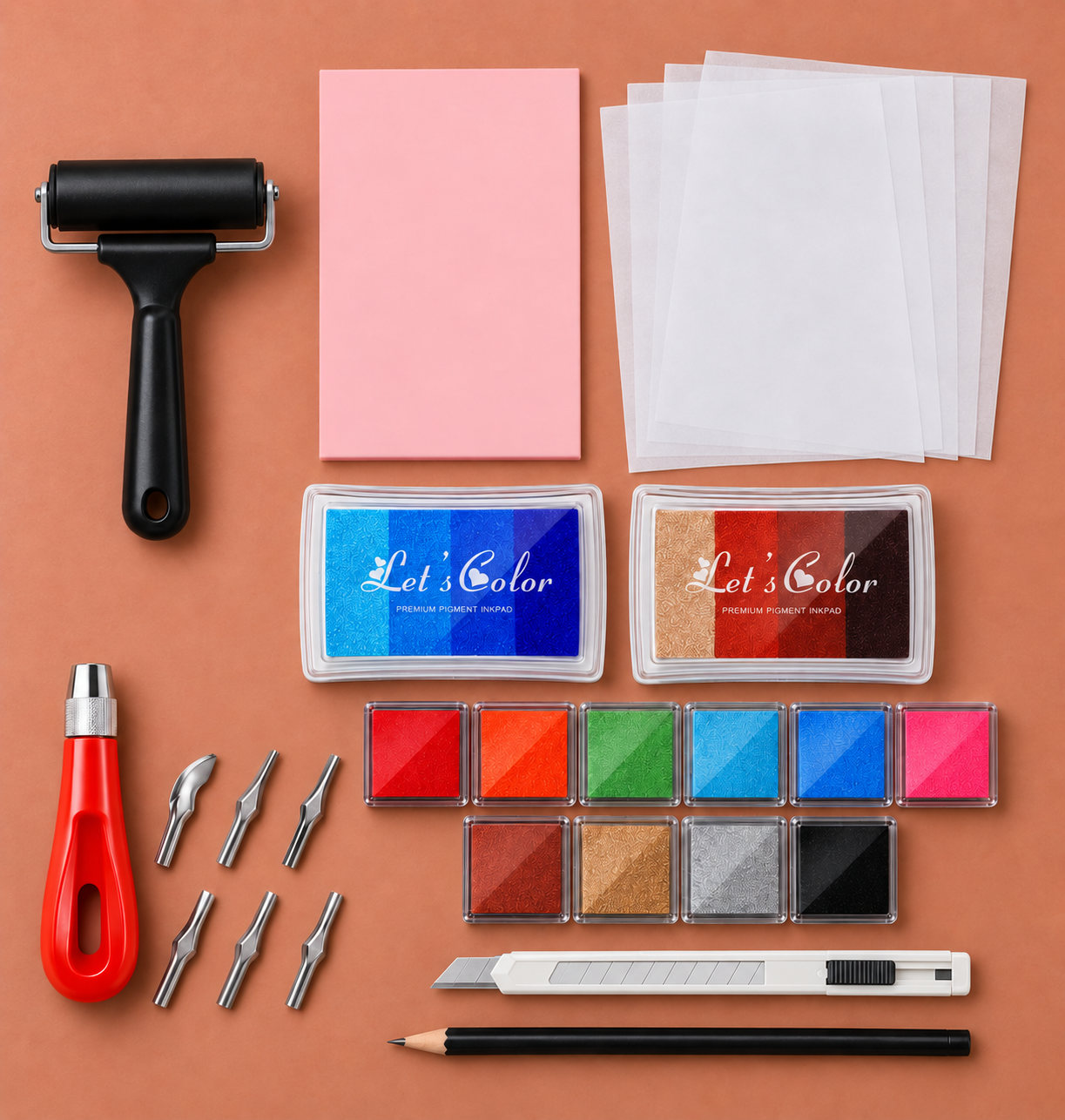 Expanded rubber stamp carving kit with pink block, roller, five tracing sheets, two gradient pads, ten square pads, red handle and six tips, utility knife and pencil